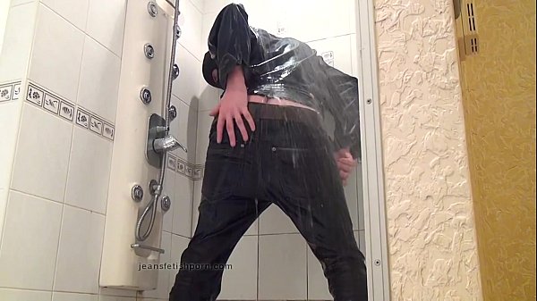 The master in blue jeans washes himself in the bathroom